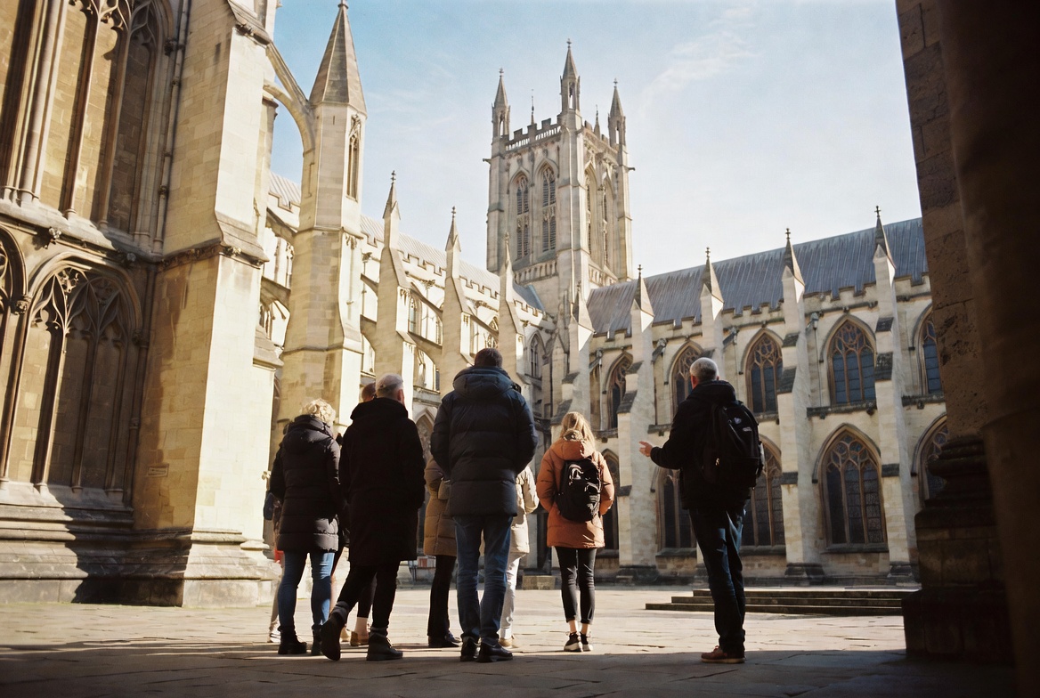 A small Abbey Creed tour group photographed outside Southwark Cathedral.