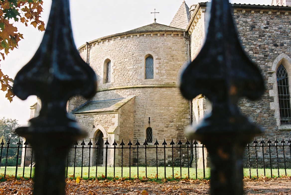 Walkers under the gate of Temple Church.