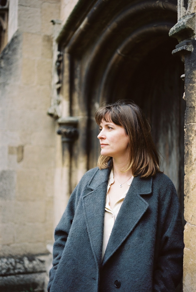 Eleanor Ashby photographed in a London cloister courtyard.